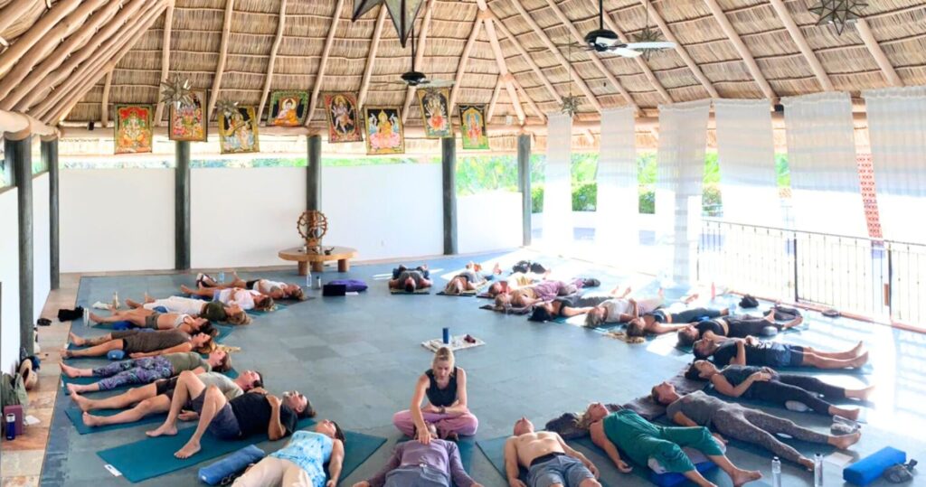 facebook unity breathwork logo – Unity Breathwork In-person breathwork facilitator training session with teacher holding space for large group
