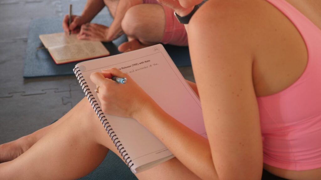 P1150830 – Unity Breathwork student taking notes at our in-person breathwork facilitator training