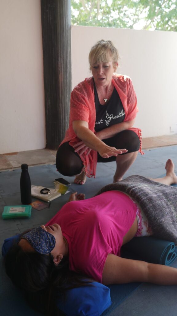 P1150952 – Unity Breathwork in-person and online breathwork facilitator training certification student holding space