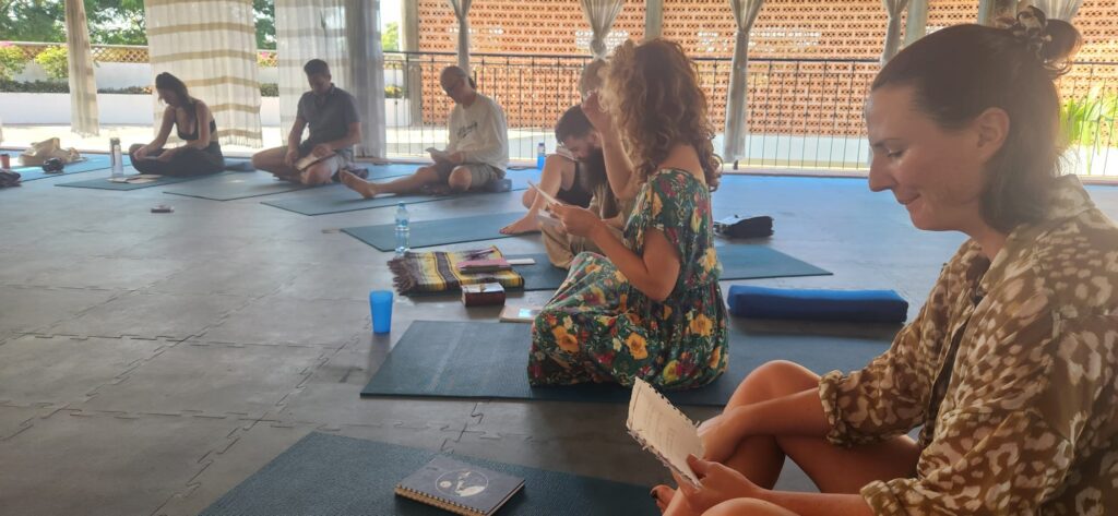 WhatsApp Image 2024-12-12 at 195924_d040fb4a – Unity Breathwork trauma-informed breathwork facilitator training class with students sitting and taking notes