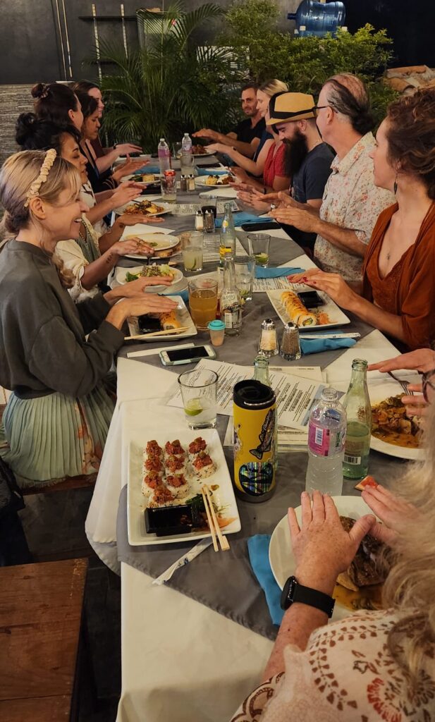 breathwork retreat dinner with everyone blessing food