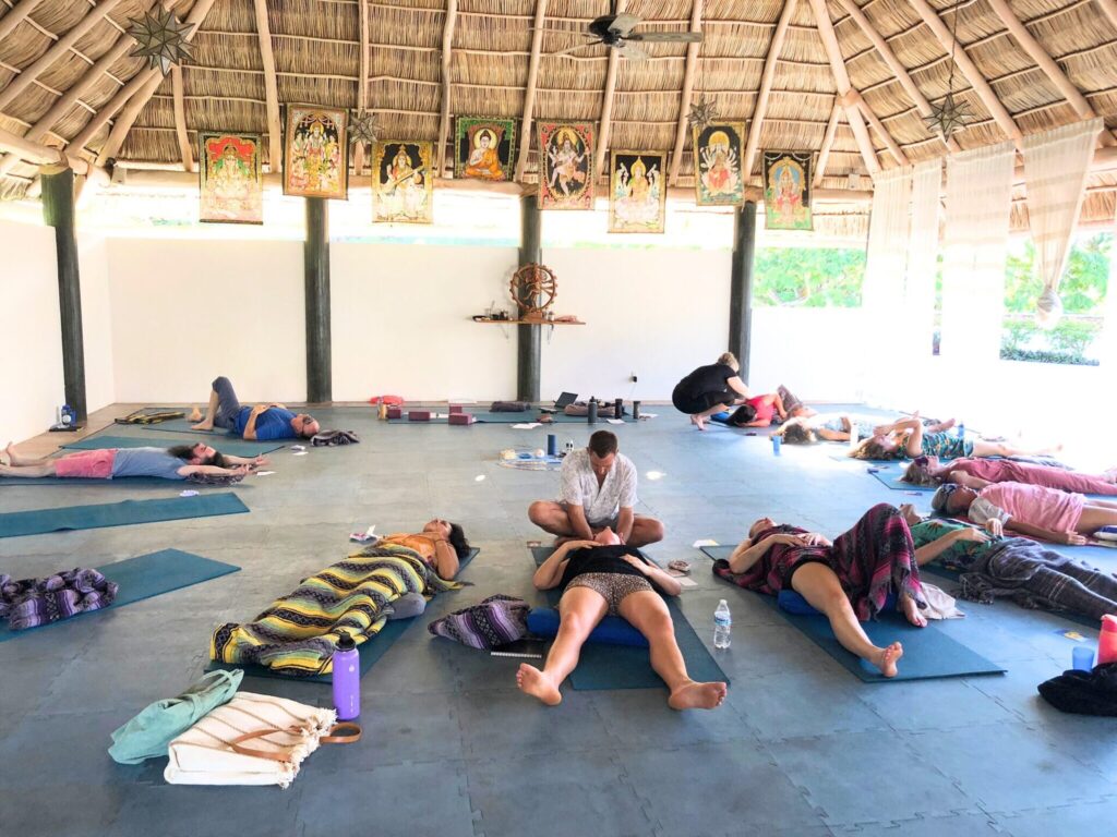 in persosn breathwork training – Unity Breathwork breathwork facilitator training in person segment with student holding space for large group